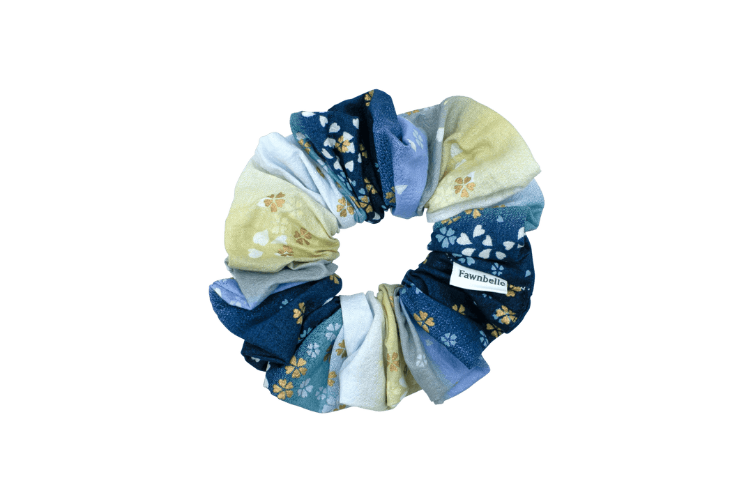 Set of blue and beige scrunchies with floral patterns on a black background cotton