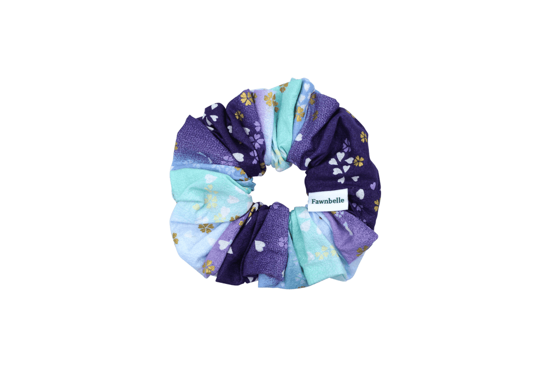 Multicolored scrunchie with floral pattern on a black background cotton