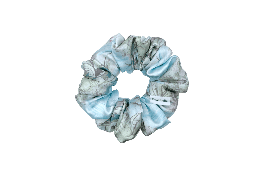 Light blue scrunchie with floral pattern and beach vibes satin