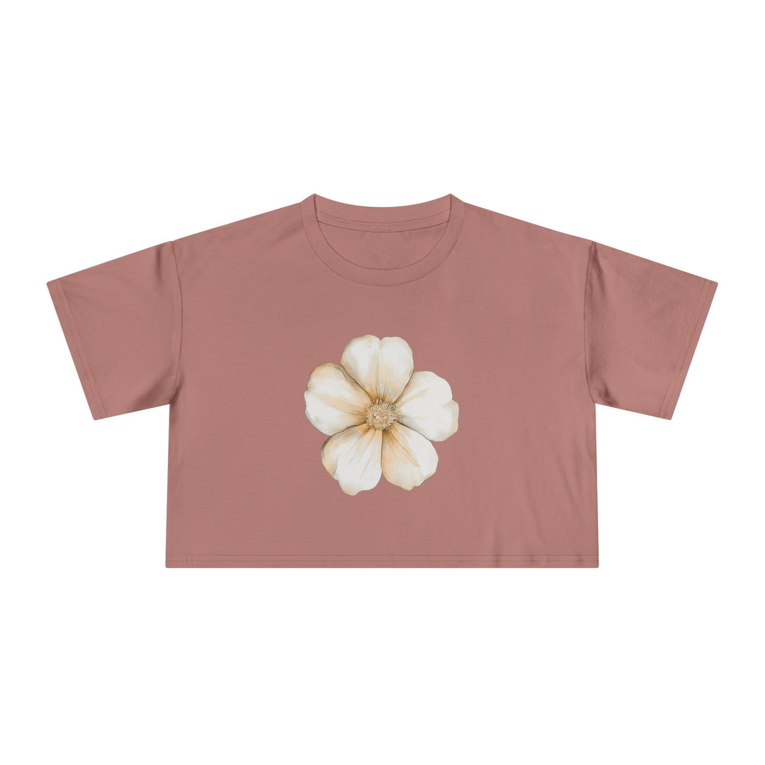 Women's dusty pink crop top with a single watercolour flower bloom in cream and gold tones, Norwynd nature-inspired apparel